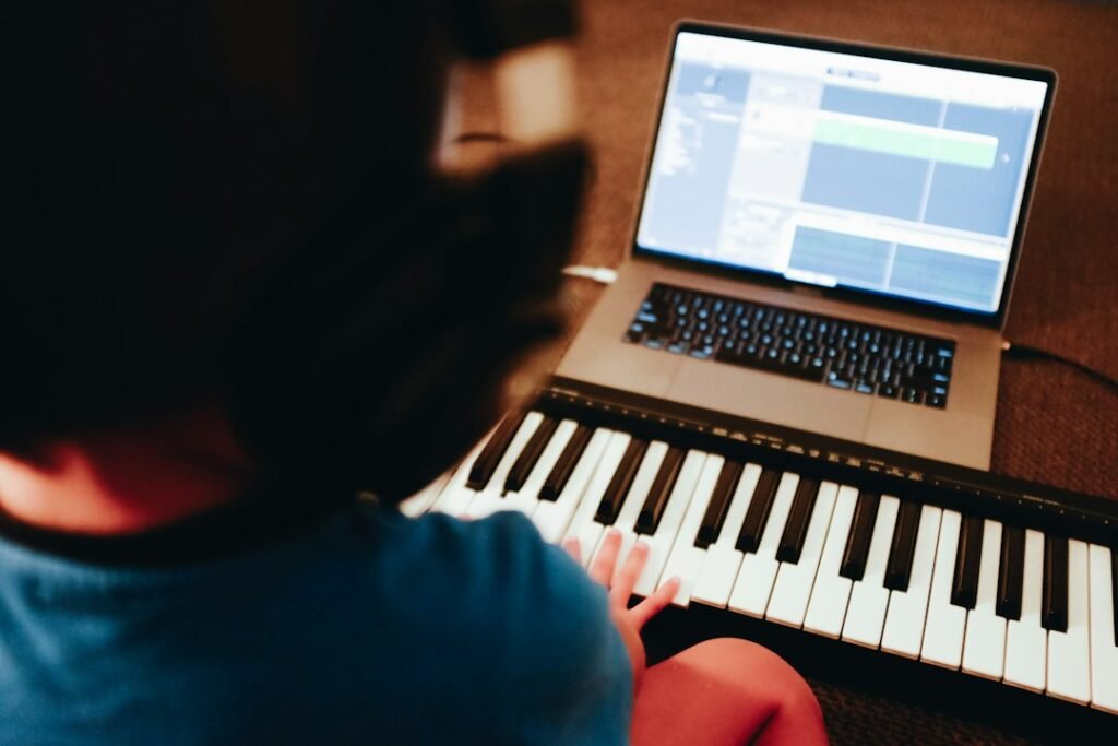 Student following an online music lesson at home