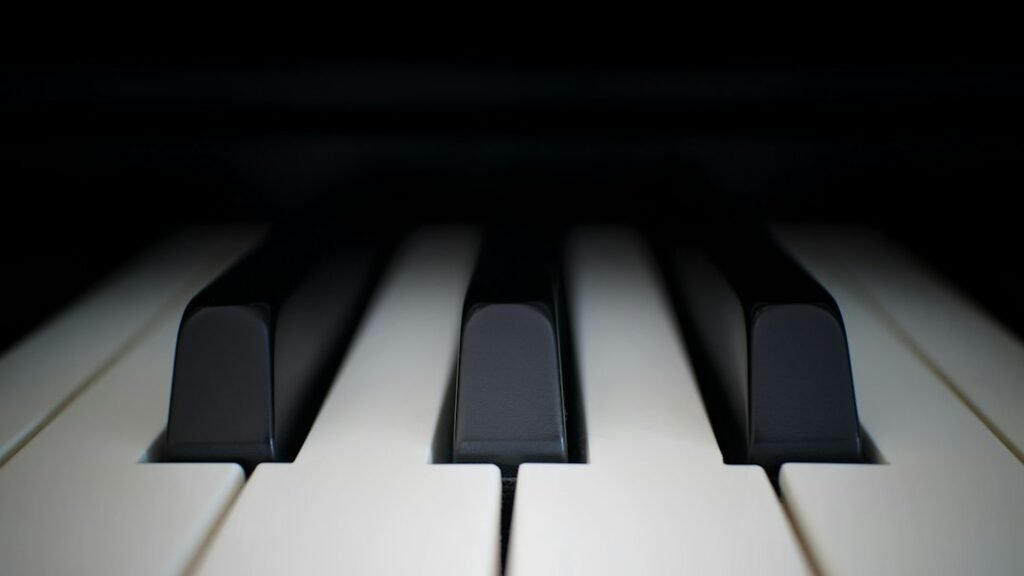 Close-up view of piano keys for a 61-key versus 88-key beginner guide